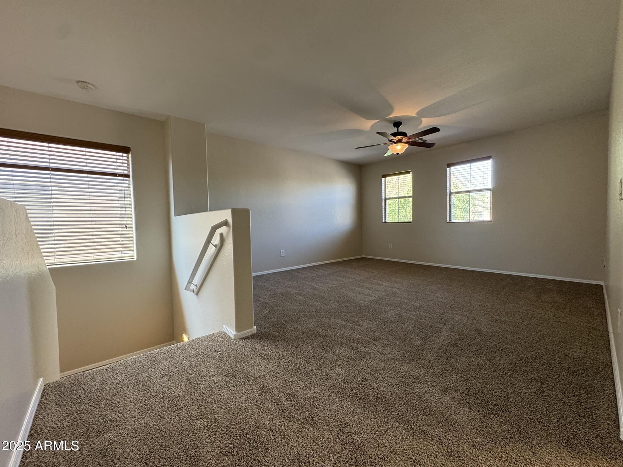 2311 West Hunter Court Phoenix, AZ 85085 - Photo 13 of 24 a view of a livingroom with a ceiling fan and window