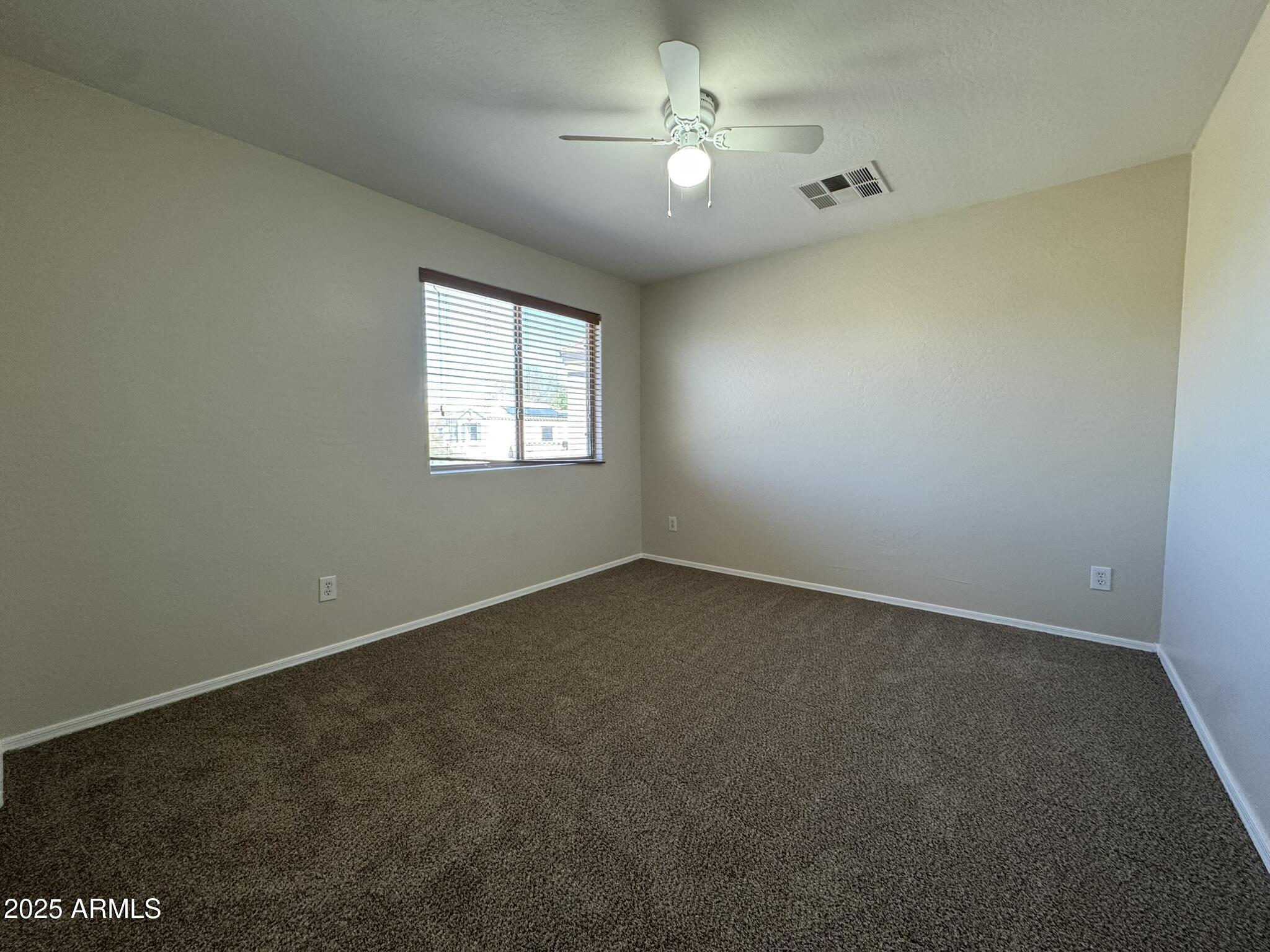 2311 West Hunter Court Phoenix, AZ 85085 - Photo 16 of 24 an empty room with a window