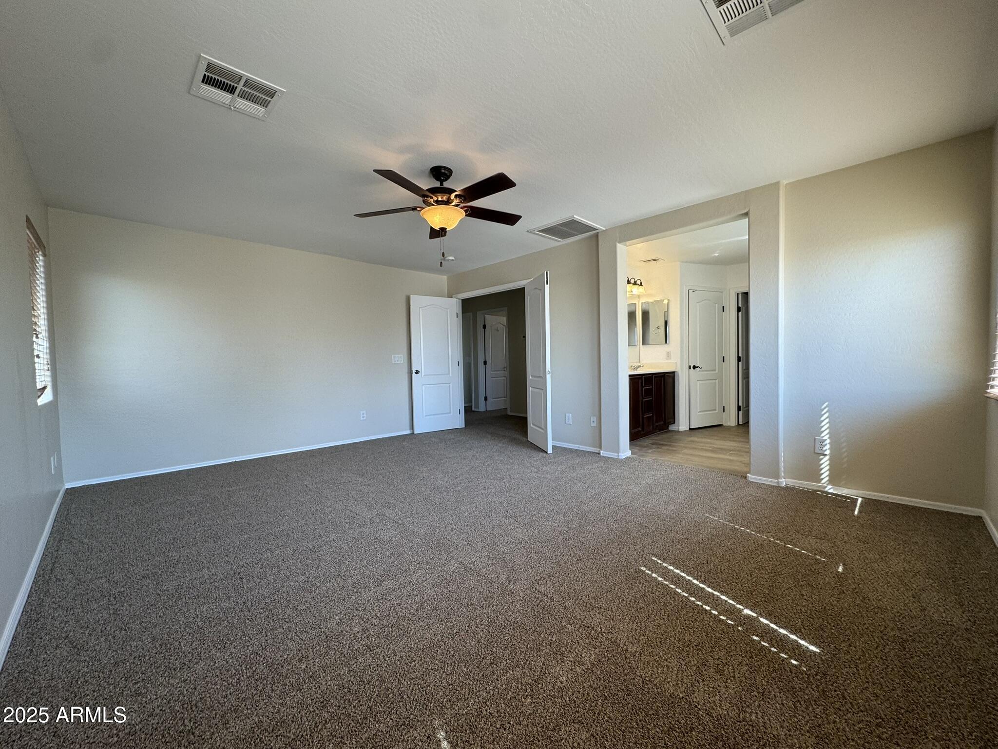 2311 West Hunter Court Phoenix, AZ 85085 - Photo 19 of 24 a view of an empty room with a window