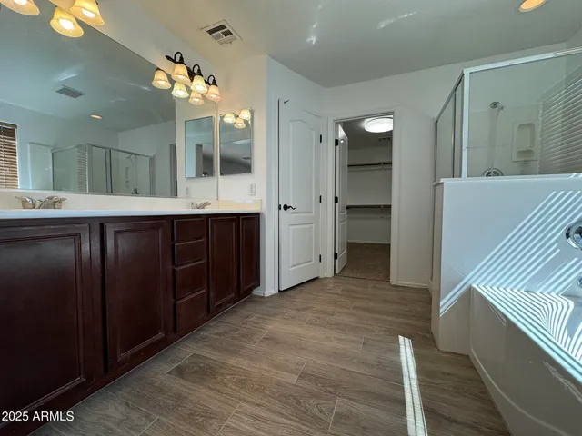 a bathroom with a sink and mirror