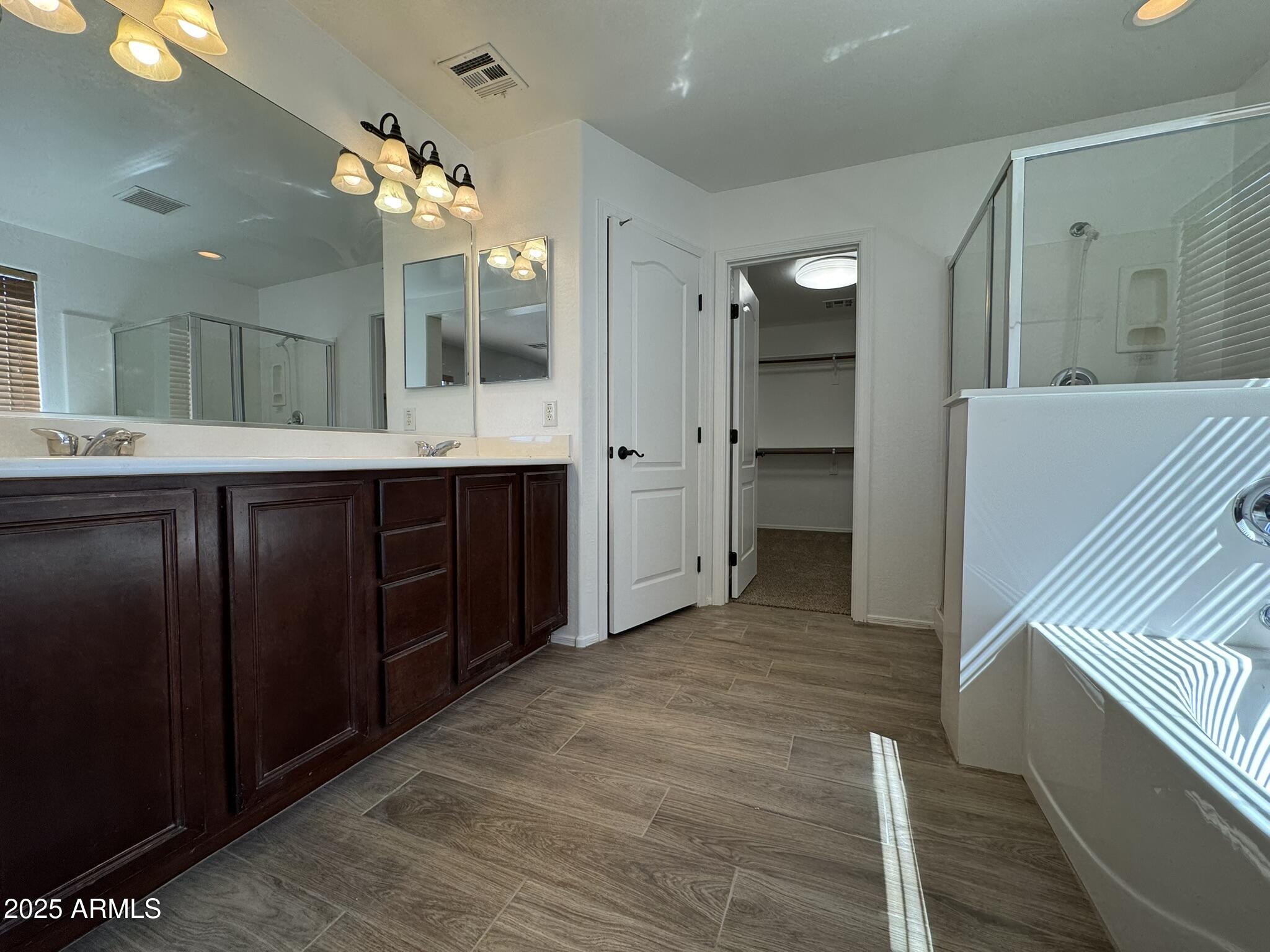 2311 West Hunter Court Phoenix, AZ 85085 - Photo 20 of 24 a bathroom with a sink and mirror