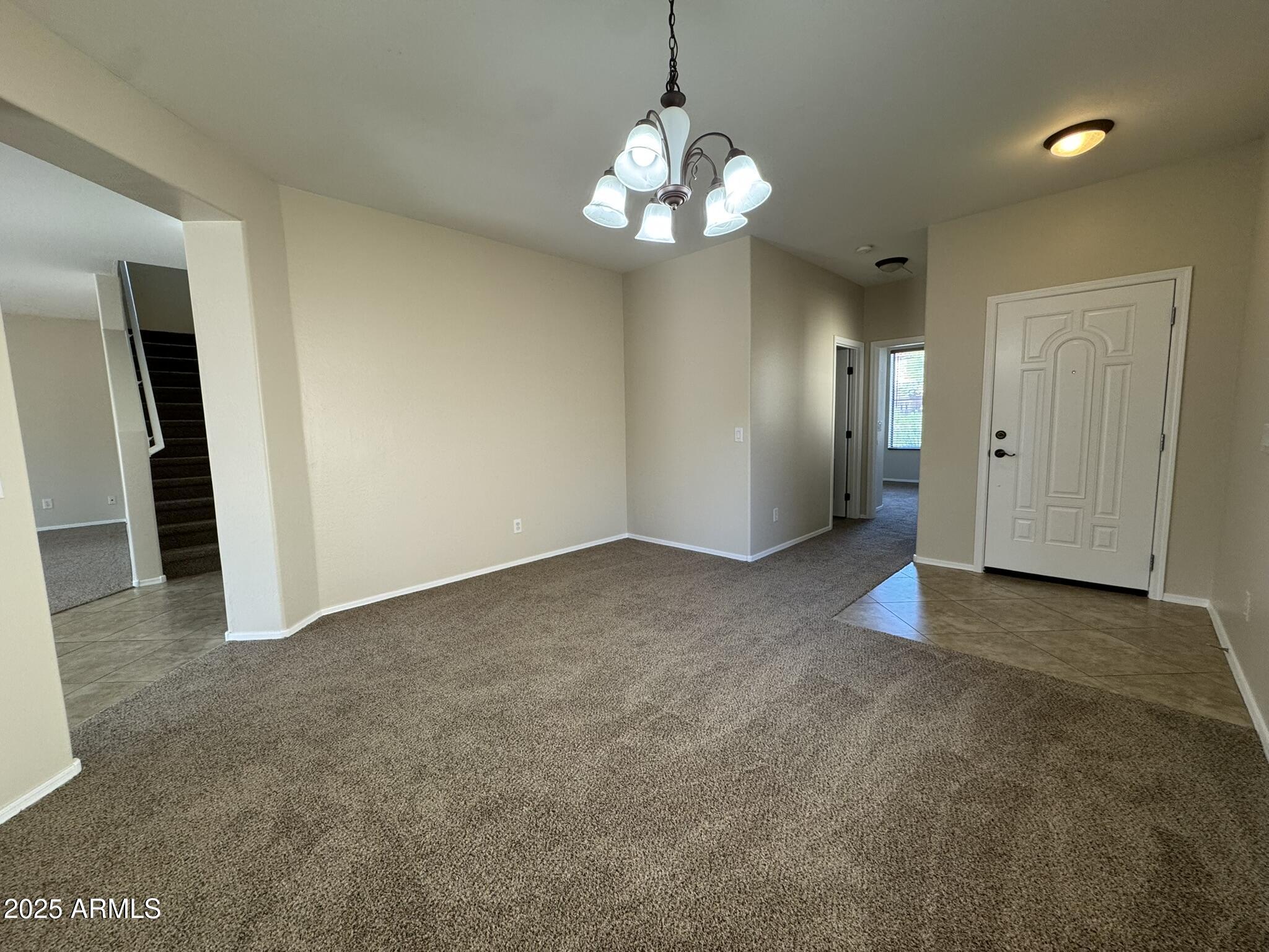 2311 West Hunter Court Phoenix, AZ 85085 - Photo 3 of 24 a view of a chandelier in big room and chandelier