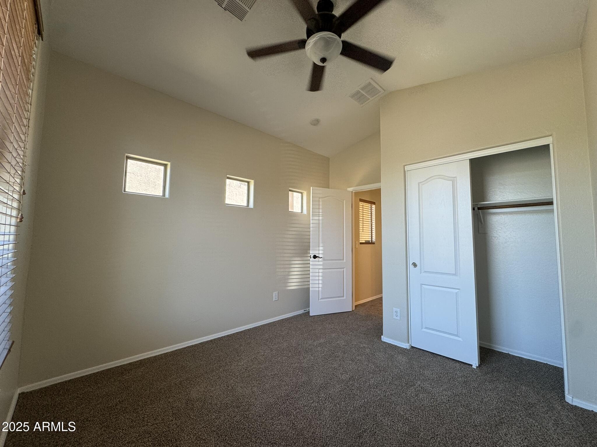 2311 West Hunter Court Phoenix, AZ 85085 - Photo 5 of 24 an empty room with closet area