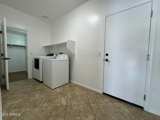 a utility room with washer and dryer