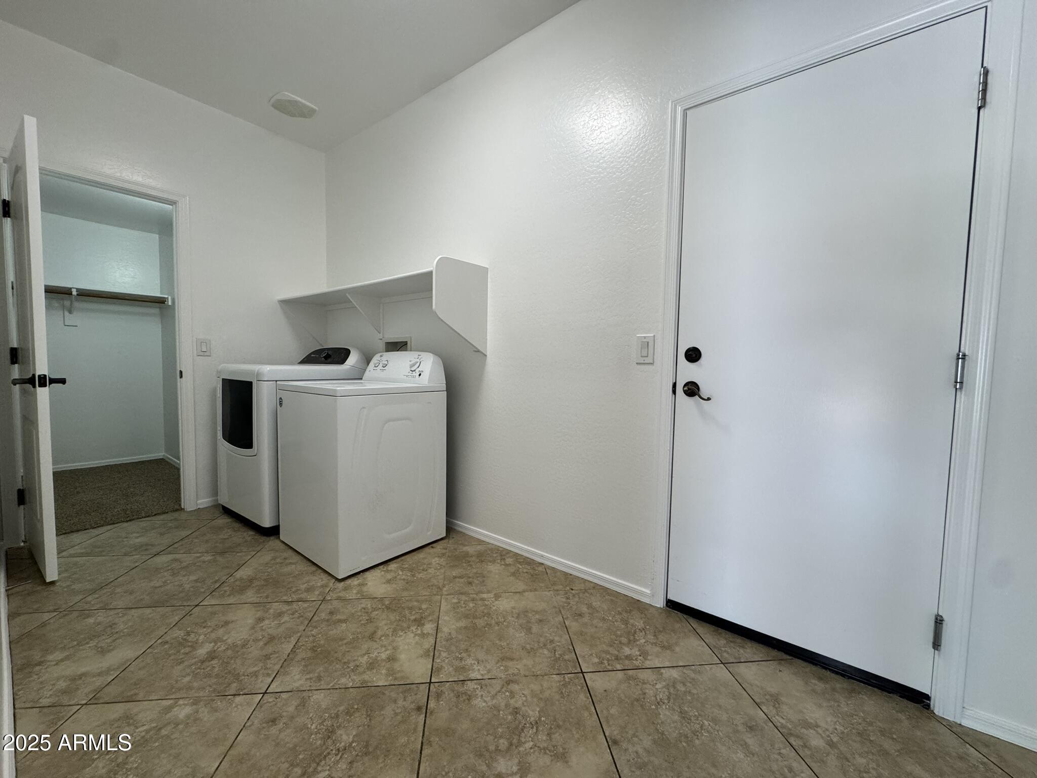2311 West Hunter Court Phoenix, AZ 85085 - Photo 10 of 24 a utility room with washer and dryer