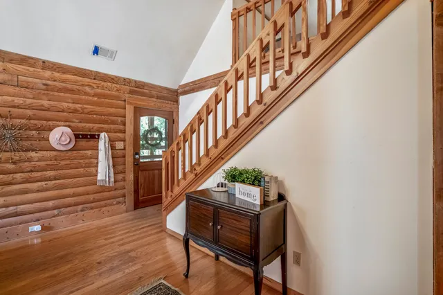 a kitchen with counter top oven and refrigerator