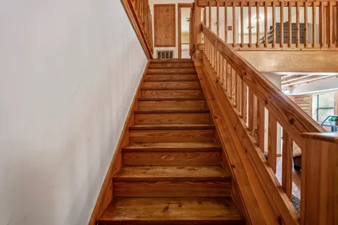 a bathroom with a bathtub and window