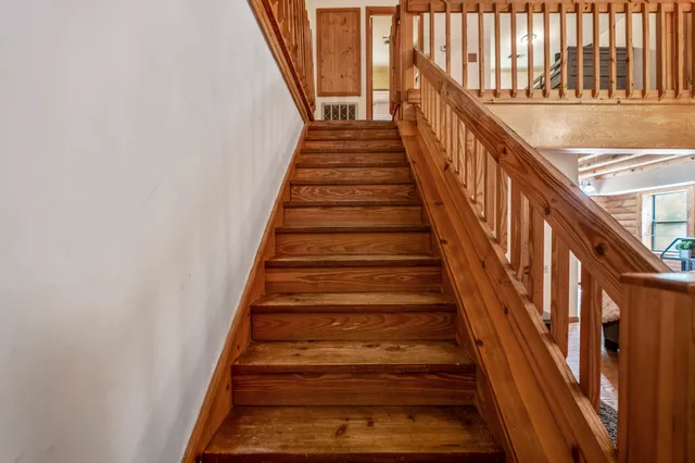 a bathroom with a bathtub and window