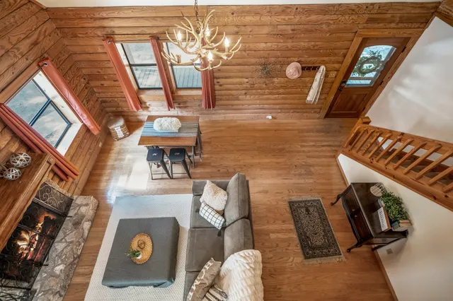 a view of living room with furniture and fireplace