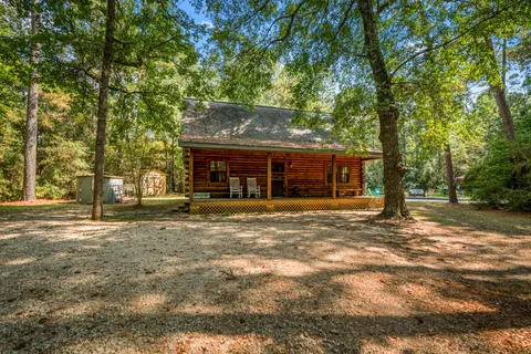 a view of a house with a back yard