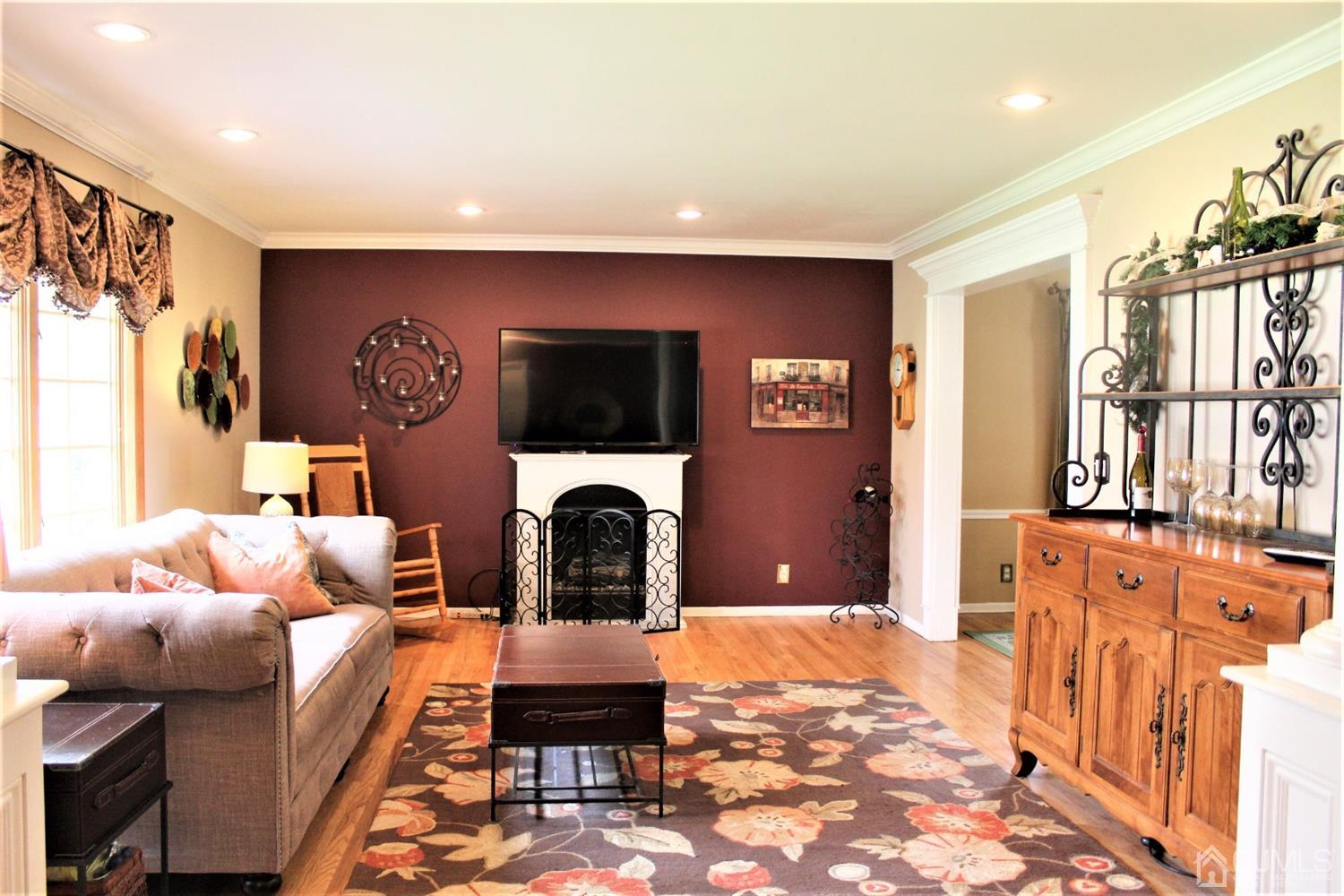 5 Golf Road Edison, NJ 08820 - Photo 3 of 45 a living room with furniture and a fireplace