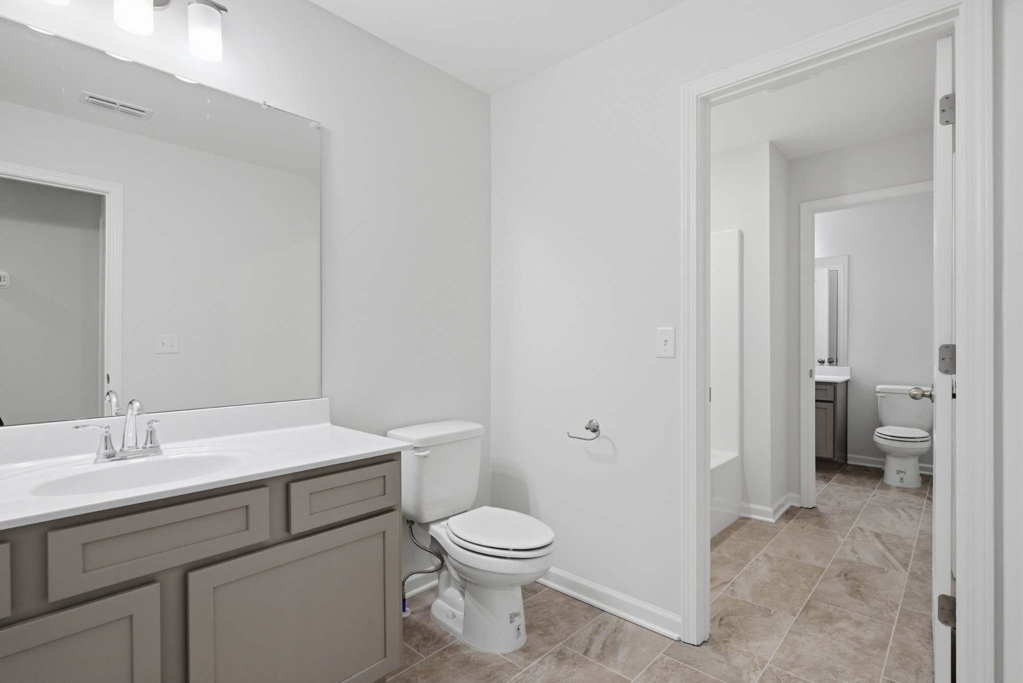 4018 Colleton Lane Rockvale, TN 37153 - Photo 20 of 34 a bathroom with a toilet a sink and a mirror