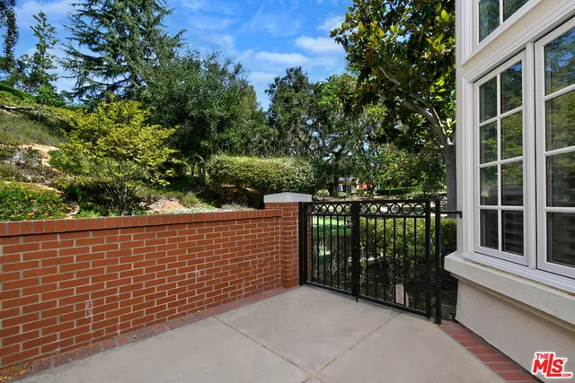 a kitchen with a sink cabinets and wooden floor