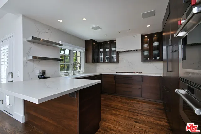 a kitchen with a sink and a window