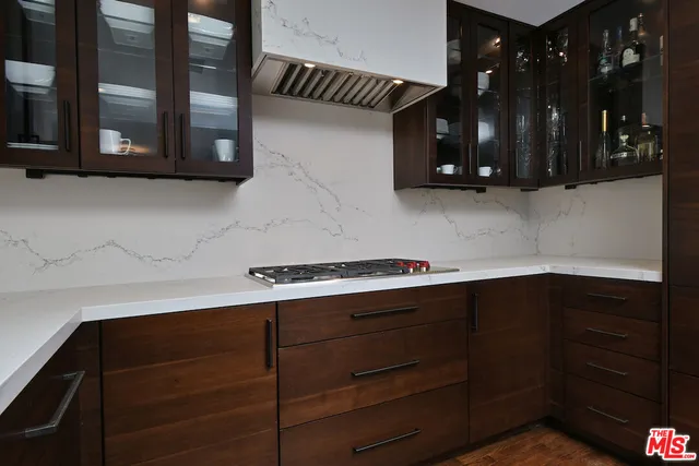 a kitchen with stainless steel appliances a stove and a refrigerator