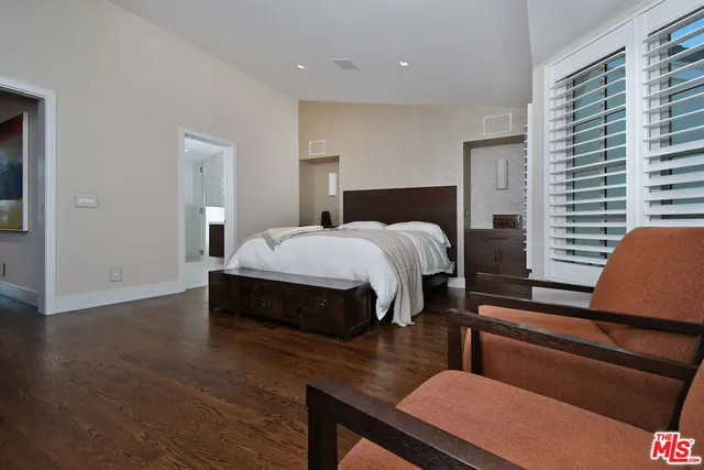 a bathroom with a double vanity sink and mirror