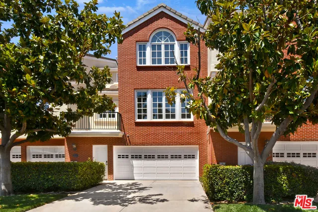 a view of a street with a houses