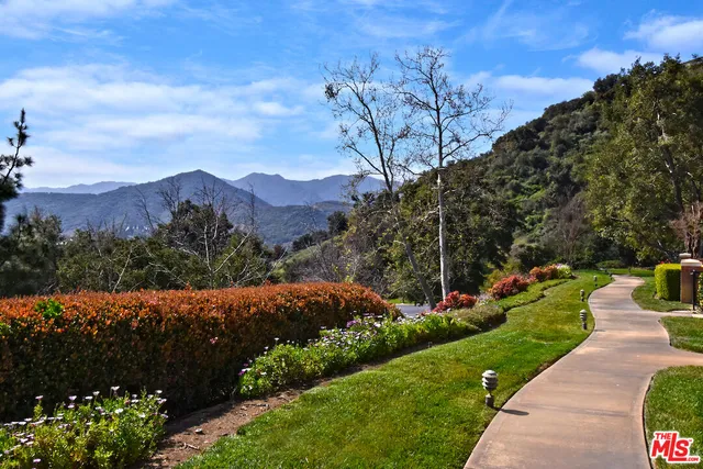 a view of a yard with an outdoor seating