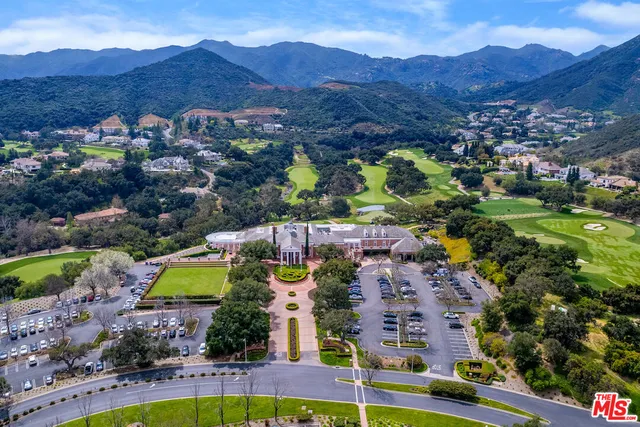 an aerial view of a house with a garden
