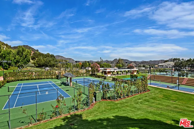 an aerial view of residential house and sandy dunes