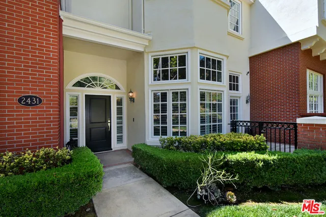 a living room with furniture a rug and a fireplace