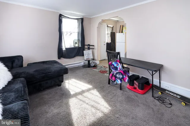 a living room with furniture and a couch