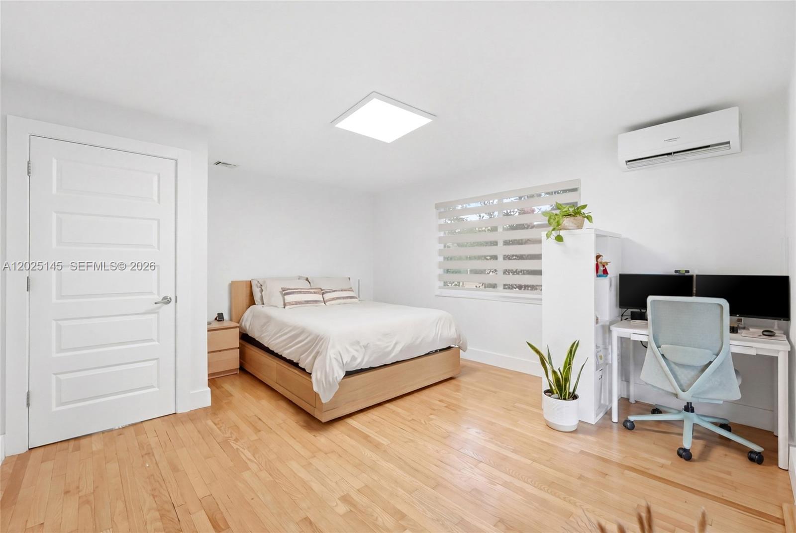 3101 Southwest 25th Terrace Miami, FL 33133 - Photo 13 of 31 a bedroom with a bed and chair