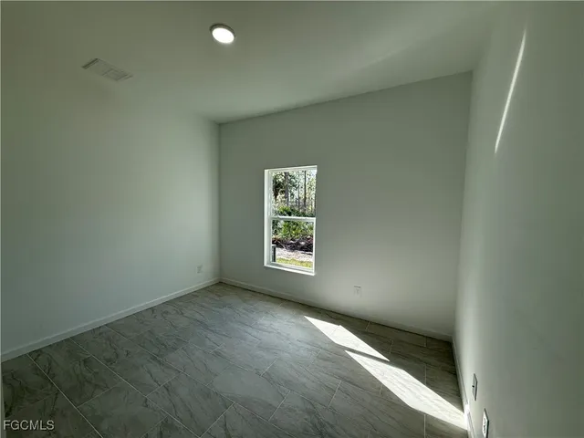 an empty room with window