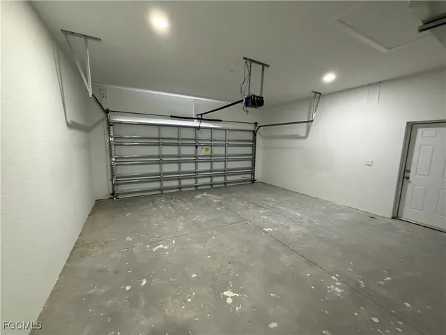 a view of a house with a yard and potted plants