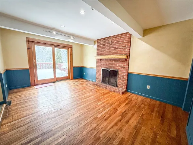 wooden floor in an empty room with window and wooden floor