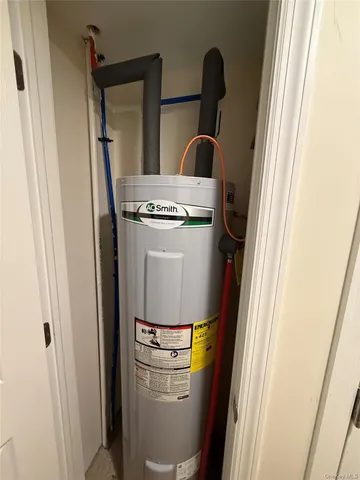 a room with water heater and washer