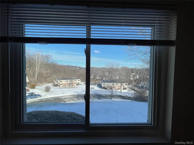 a view of a room that has a bed