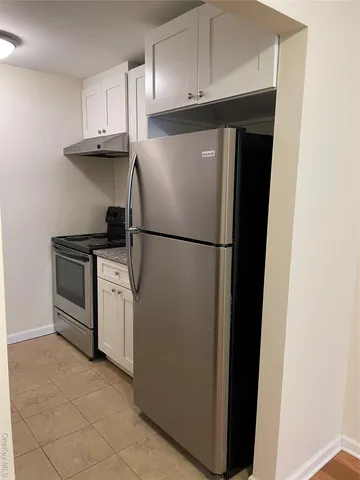 a kitchen with appliances and cabinets