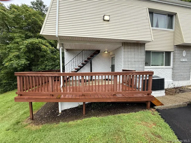 a view of a wooden deck with a bench