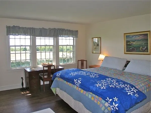 a bedroom with a bed and a table