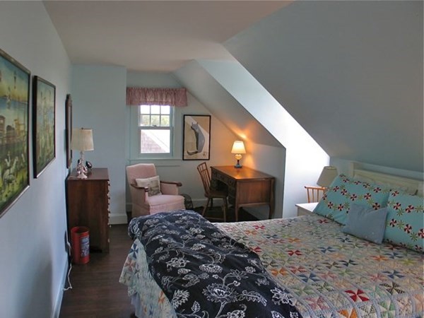 384 Middle Road Chilmark, MA 02535 - Photo 13 of 31 a bedroom with a bed and a dresser next to a window