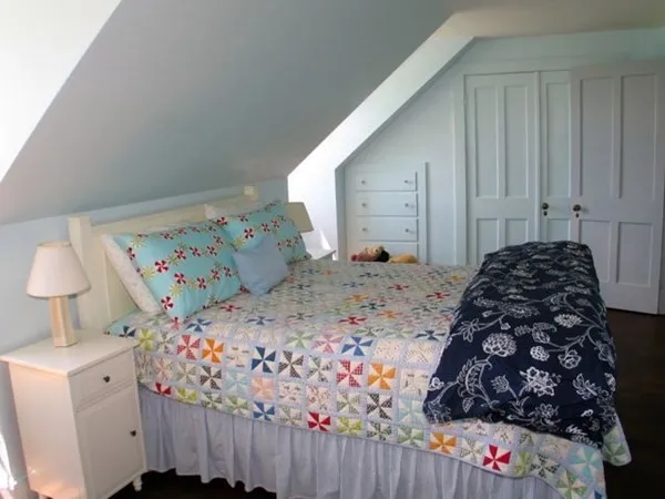 a bedroom with bed and a window