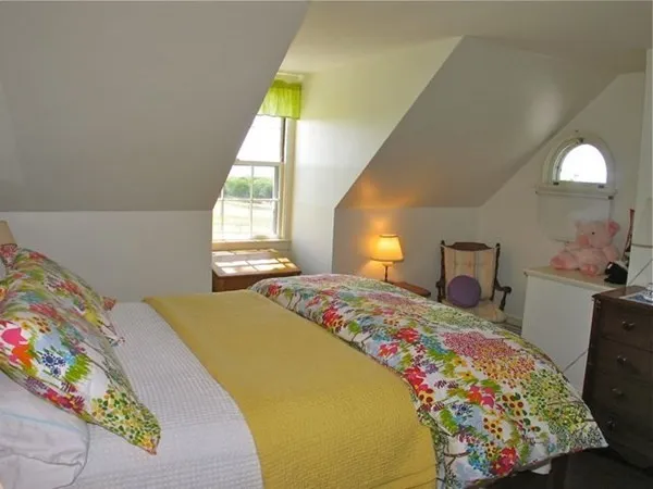 a bedroom with a bed and window