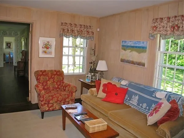 a living room with furniture and a window