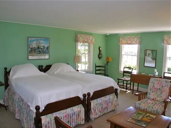 a bedroom with bed and a window