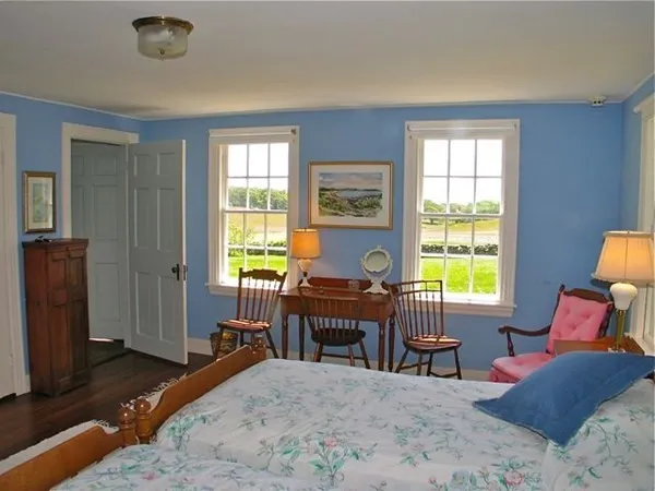 a bedroom with a bed and a couch