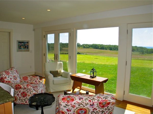 384 Middle Road Chilmark, MA 02535 - Photo 4 of 31 a living room with furniture and a floor to ceiling window