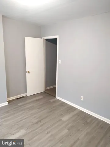 a view of a house with a door and wooden door