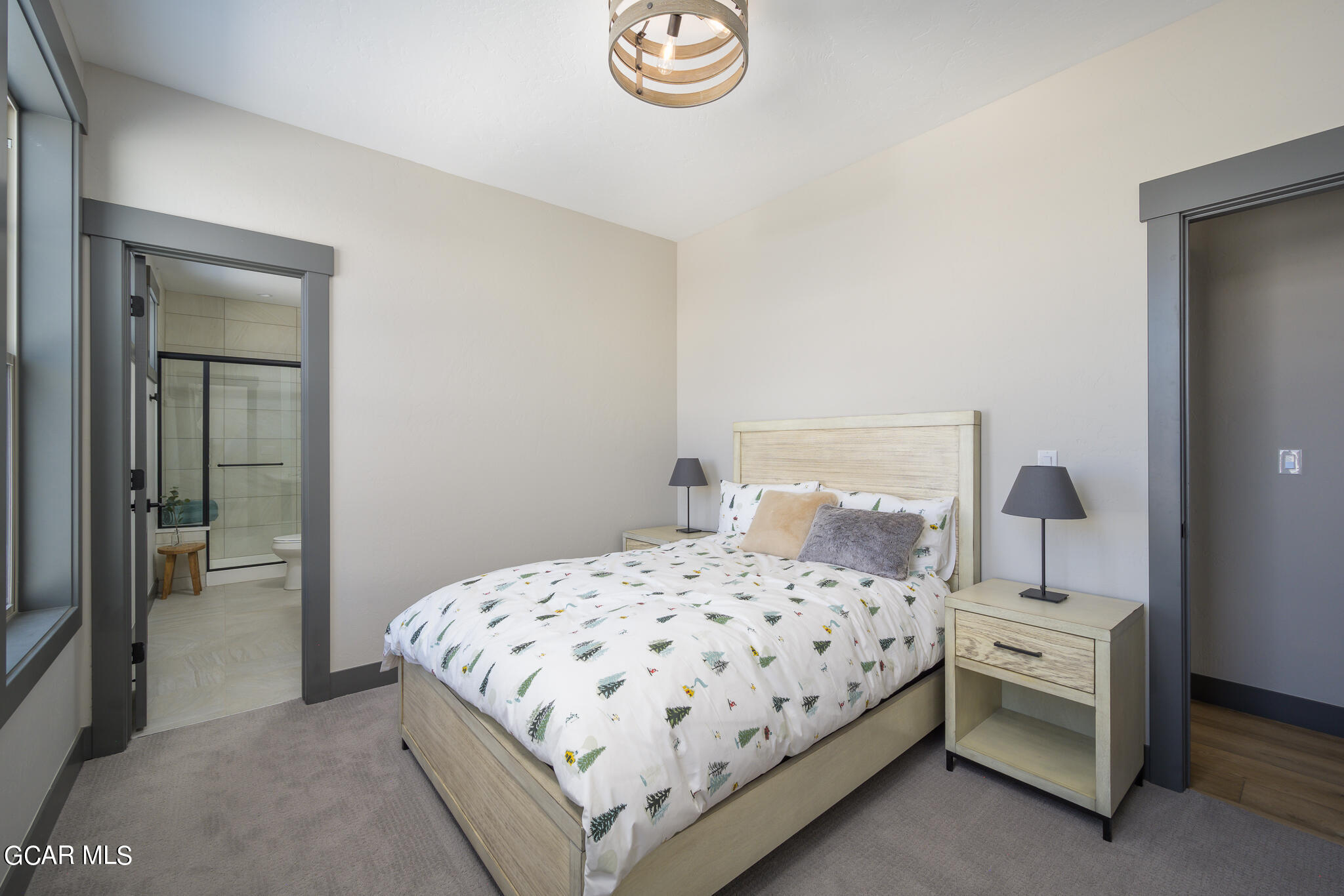 150 Eagle Ridge Drive Granby, CO 80446 - Photo 5 of 5 a bedroom with a bed and a lamp