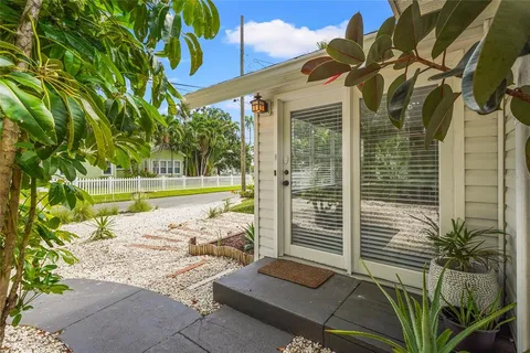 a kitchen with stainless steel appliances granite countertop a refrigerator a sink and a stove