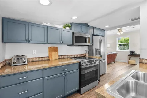 a bedroom with a bed and a table