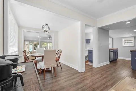a view of a patio with couple of chairs and potted plants