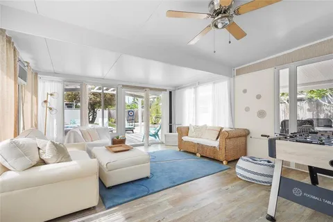 a view of a house with a tree and a yard