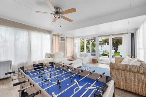 a view of a patio with table and chairs and potted plants