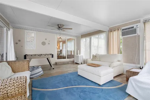 a view of a dining room with furniture and window